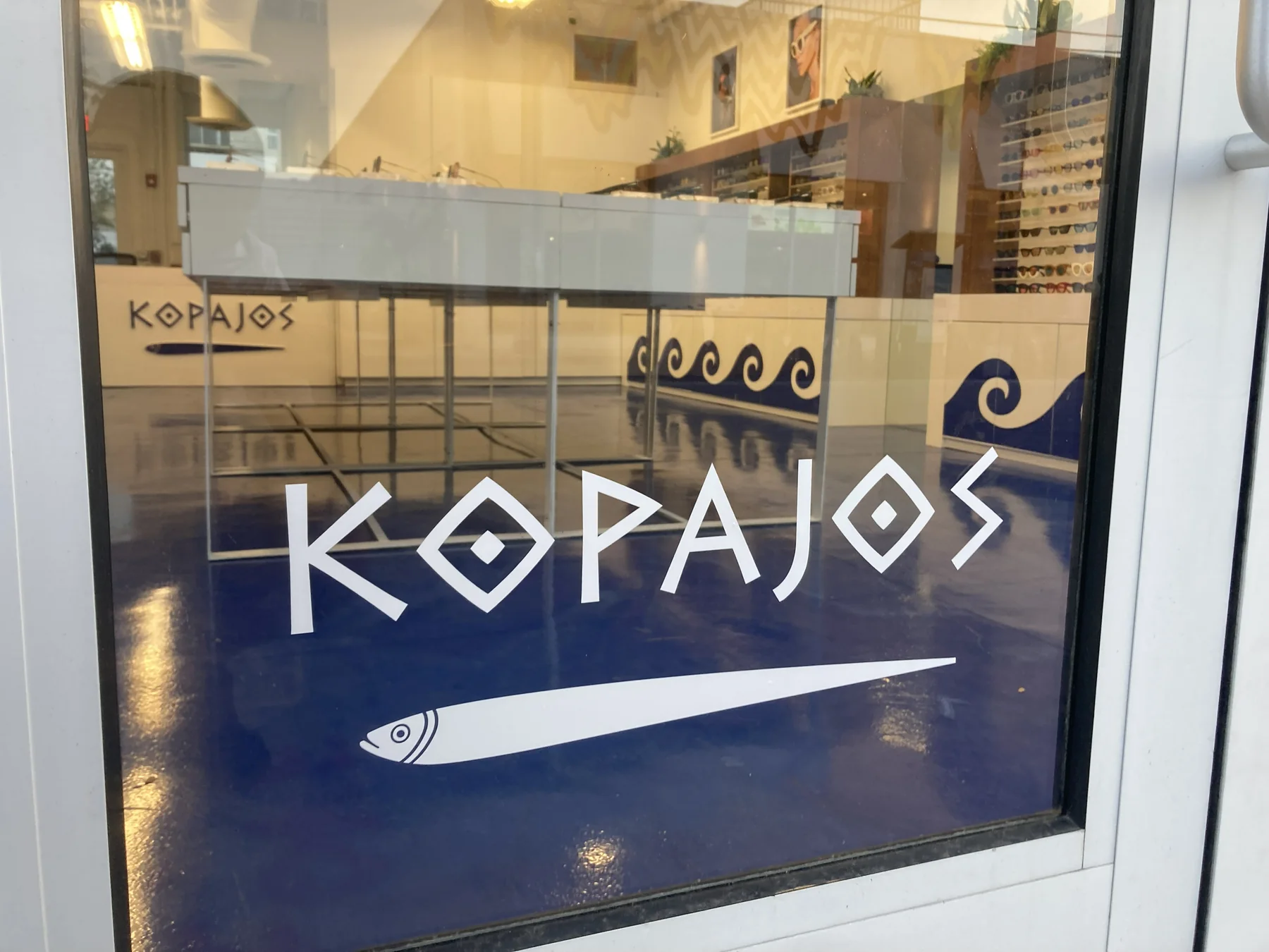 Storefront vinyl lettering designed by Tride Designs